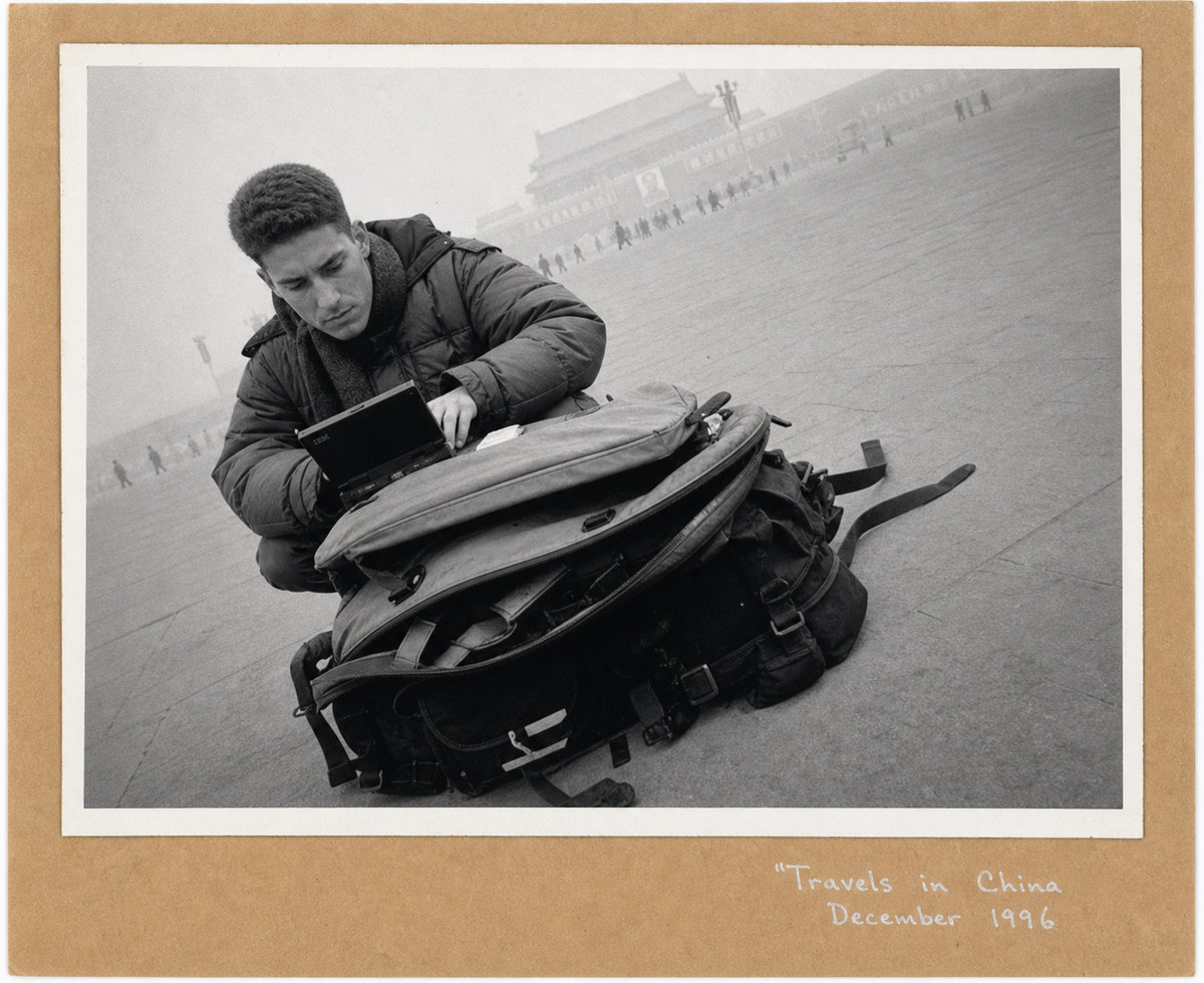 Seamus Waldron using the PC110 on a camera bag in Tiananmen Square, Beijing, December 1996
